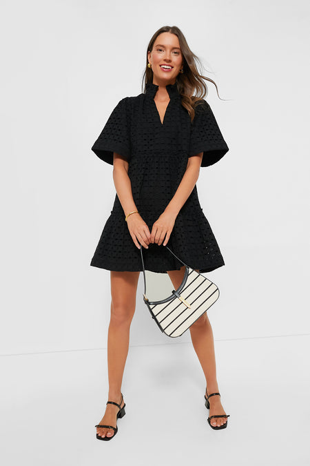 Illustrative example of black eyelet dress