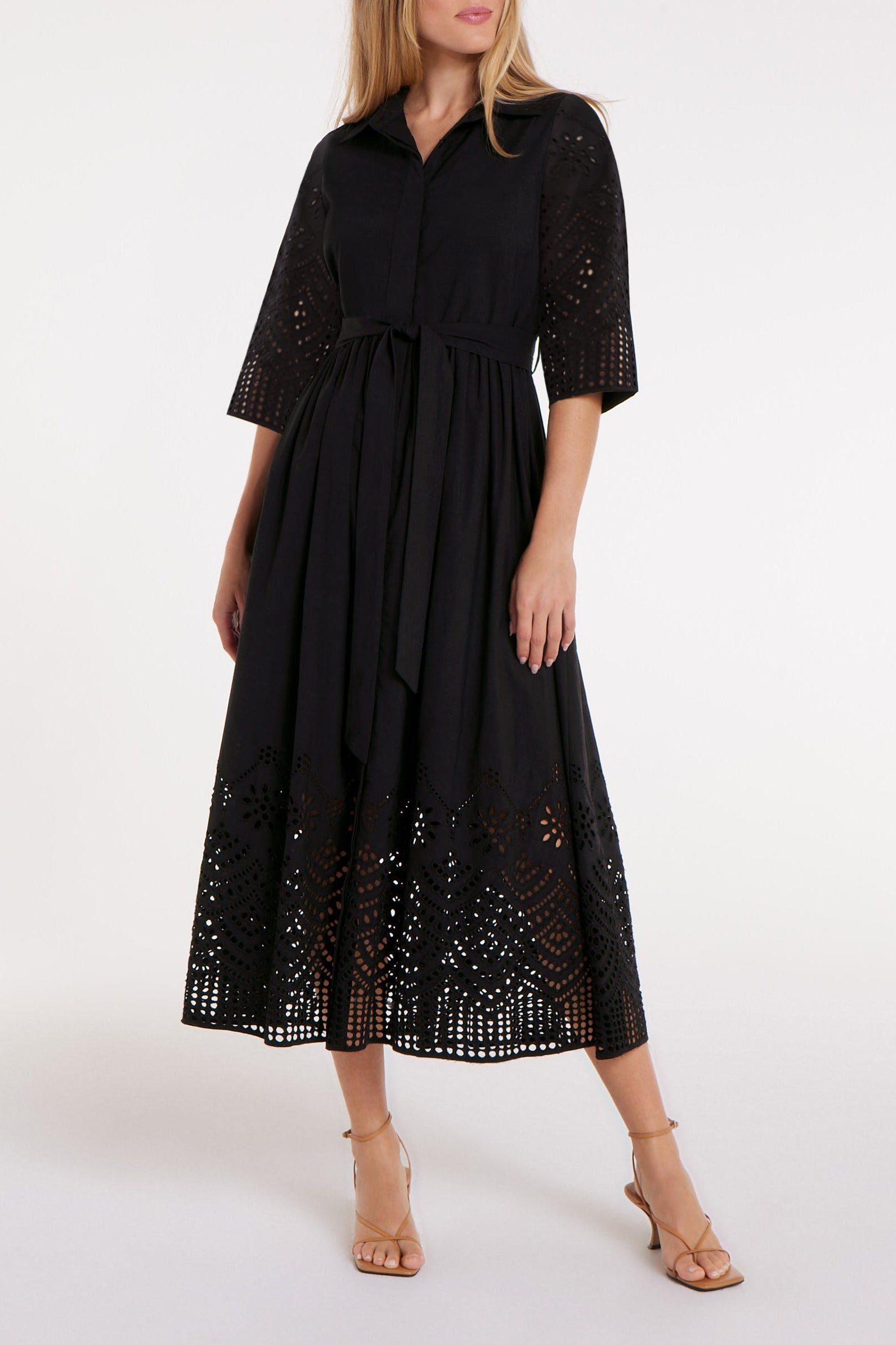 Illustrative example of black eyelet dress