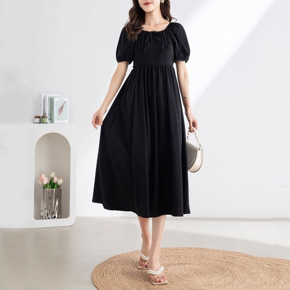 Illustrative example of black midi dress with sleeves