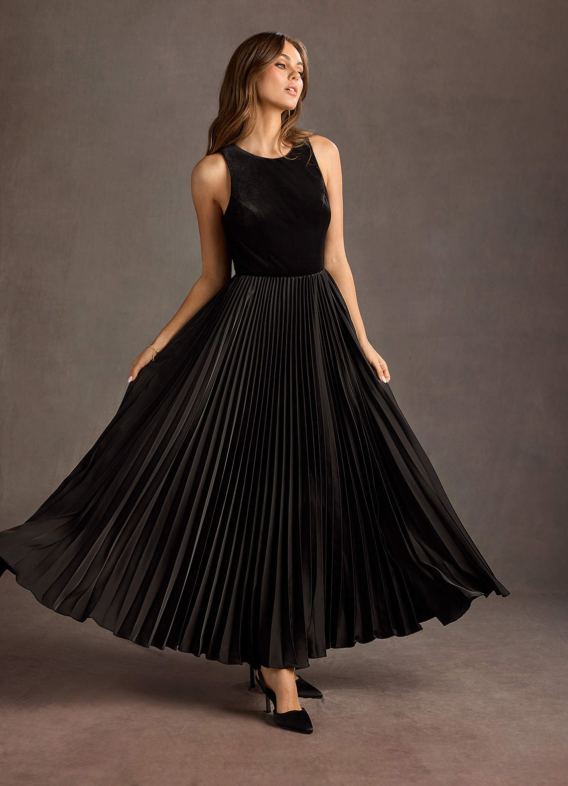 Illustrative example of black pleated dress