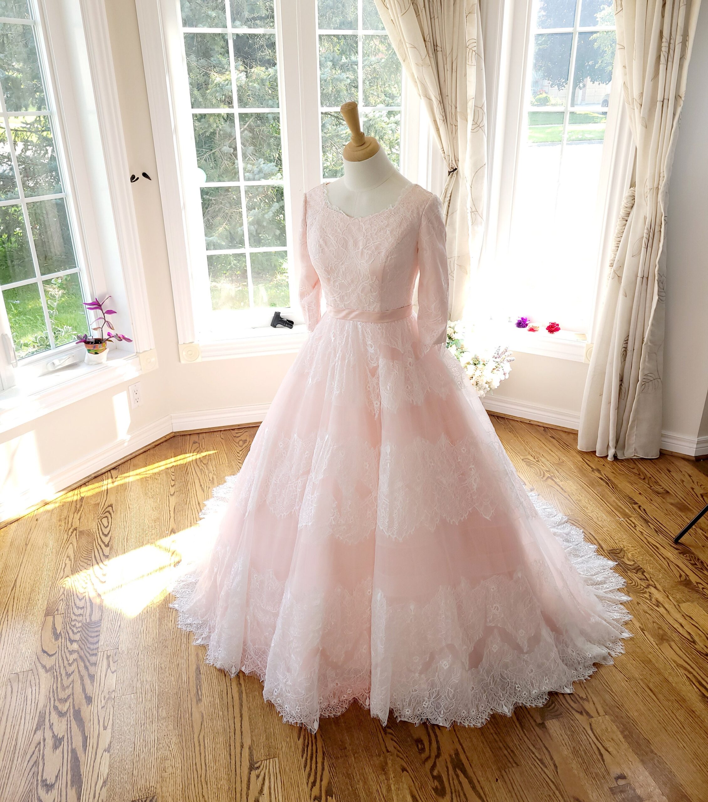 Illustrative example of blush pink wedding dress