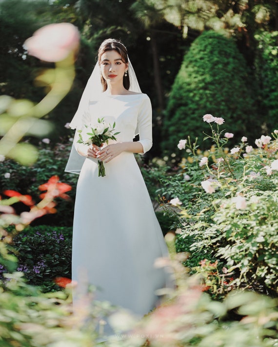 Illustrative example of boat neck wedding dress