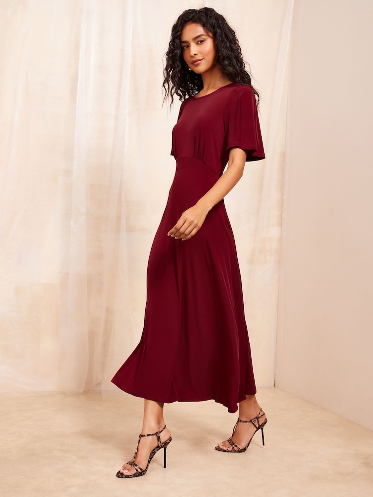 Illustrative example of burgundy midi dress