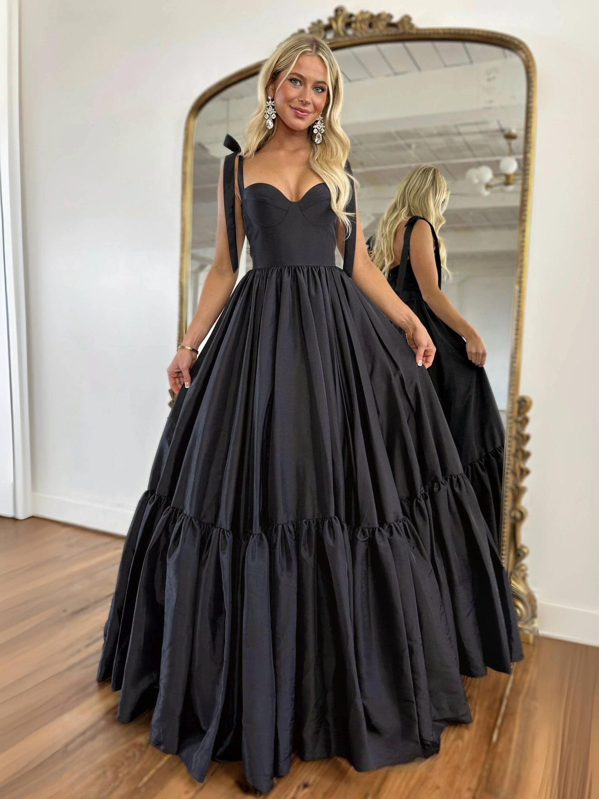 Illustrative example of elegant black dresses for wedding guests