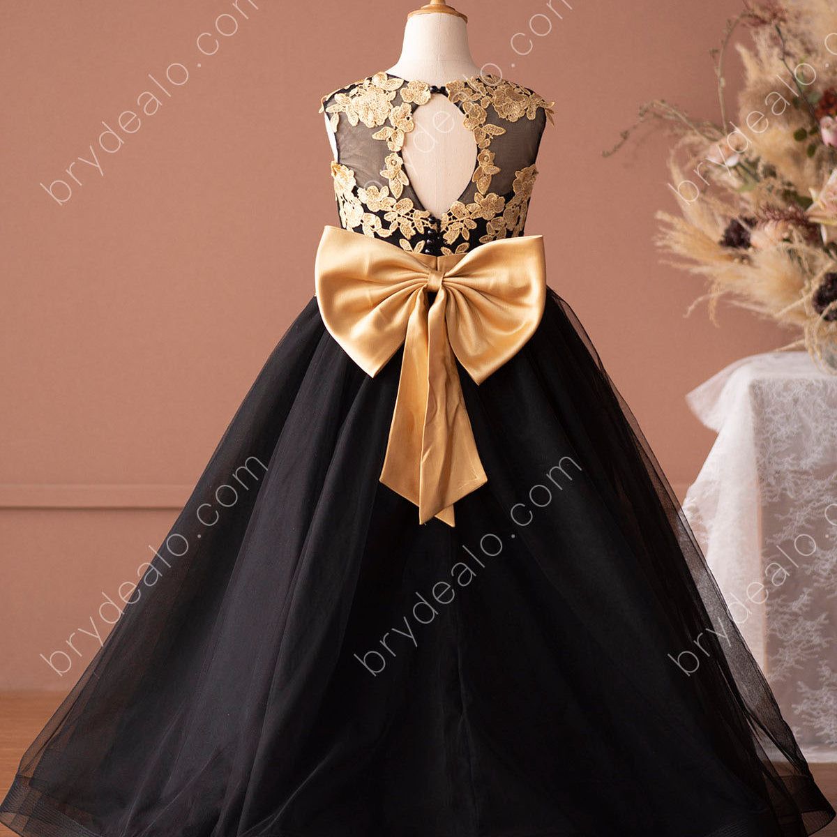 Illustrative example of gold flower girl dresses