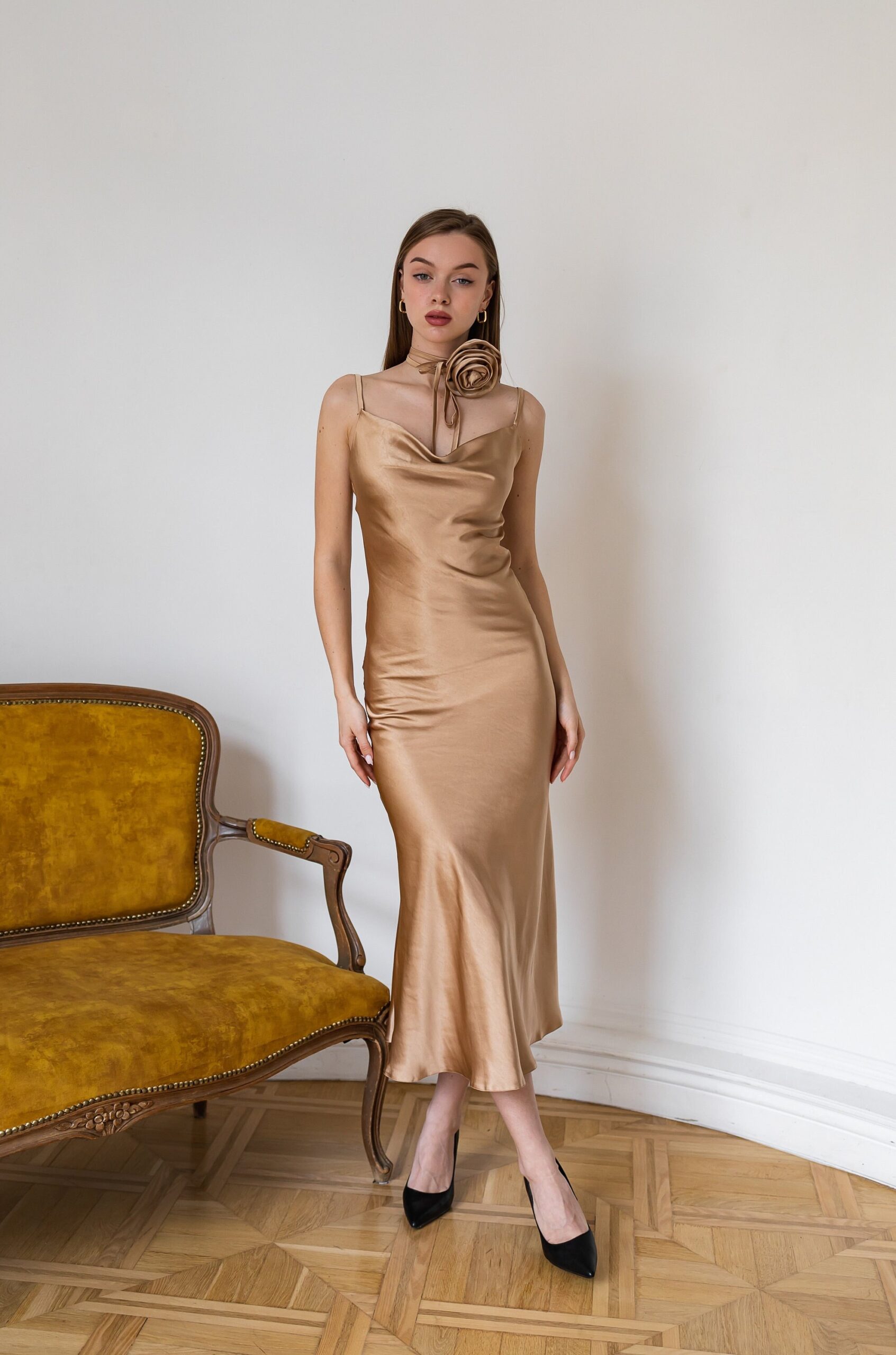 Illustrative example of gold satin dress