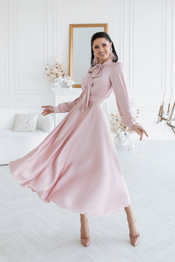 Illustrative example of light pink long dress
