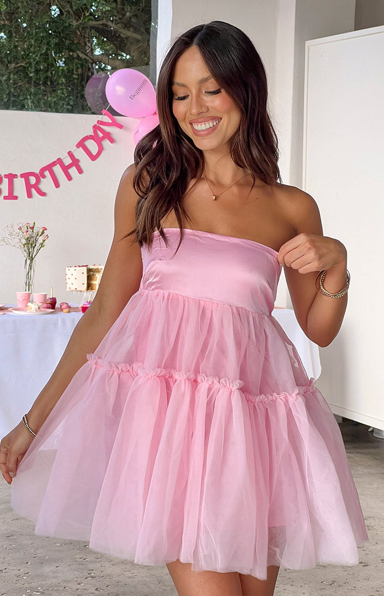 Illustrative example of mini women's light pink strapless dress for a valentine's day