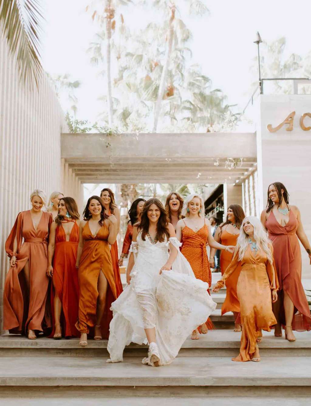 Illustrative example of orange color bridesmaid dresses