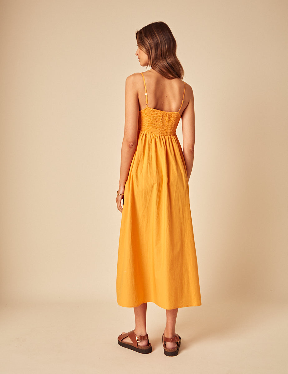 Illustrative example of orange midi dress