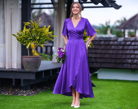 Illustrative example of purple wedding guest dress