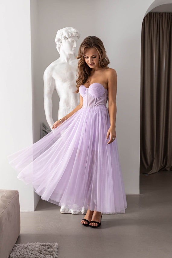 Illustrative example of purple wedding guest dress