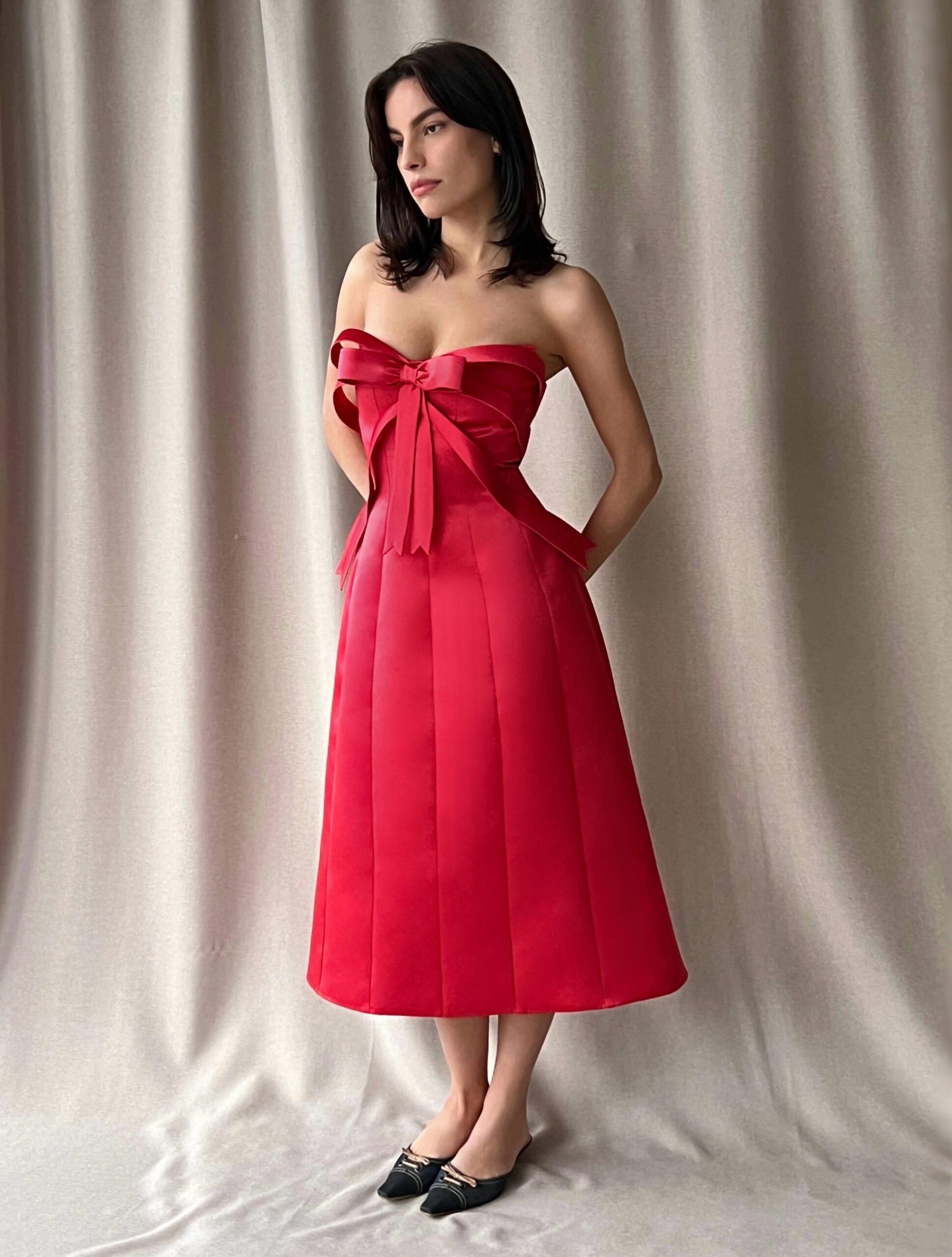 Illustrative example of red bow dress
