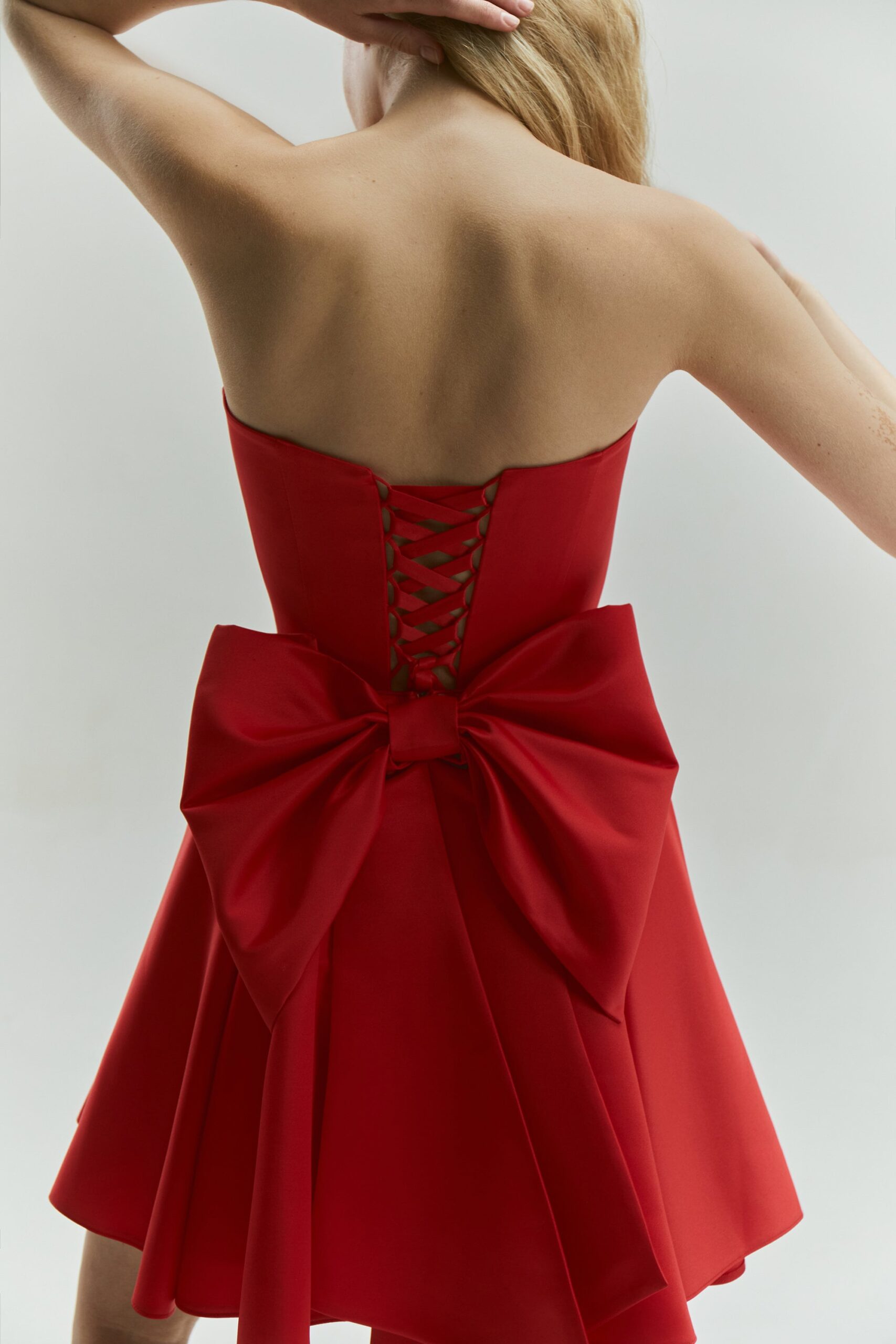 Illustrative example of red bow dress