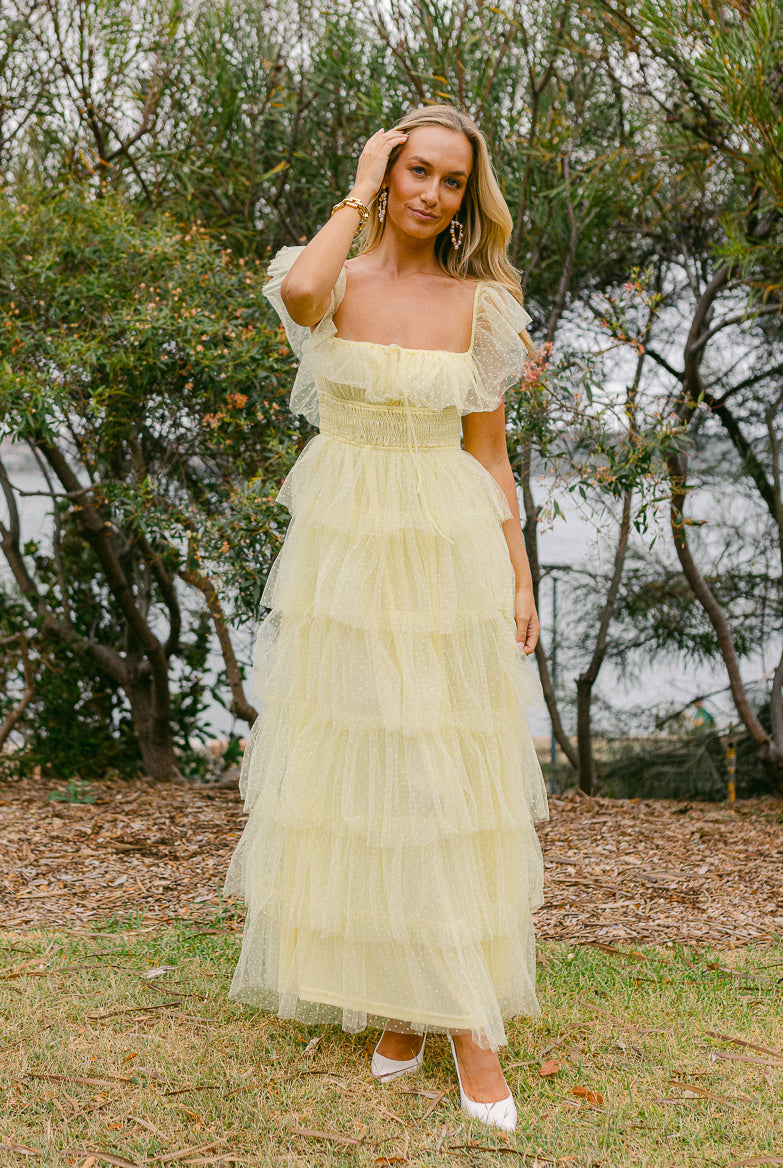 Illustrative example of wedding guest dresses butter yellow