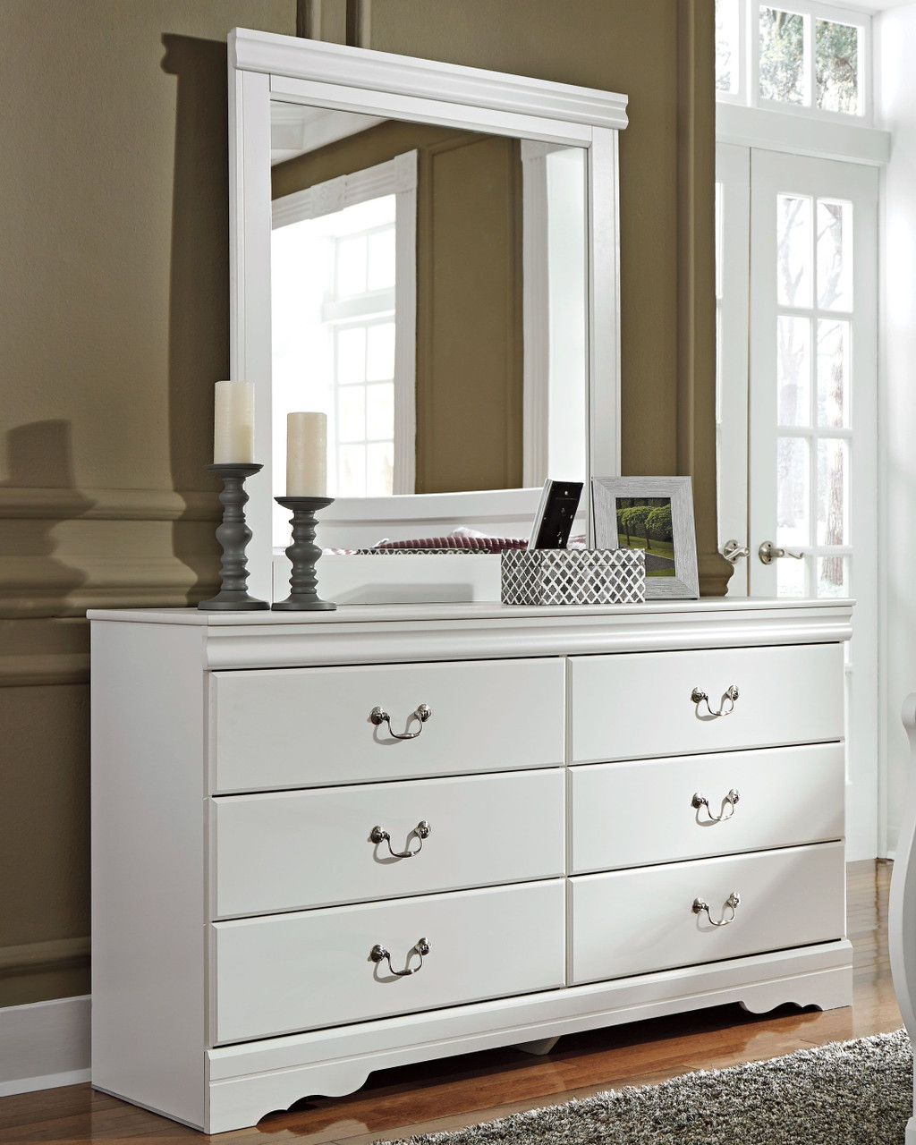 Illustrative example of white dresser and mirror