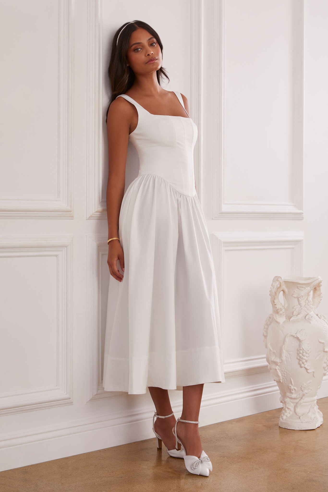 Illustrative example of white drop waist dress