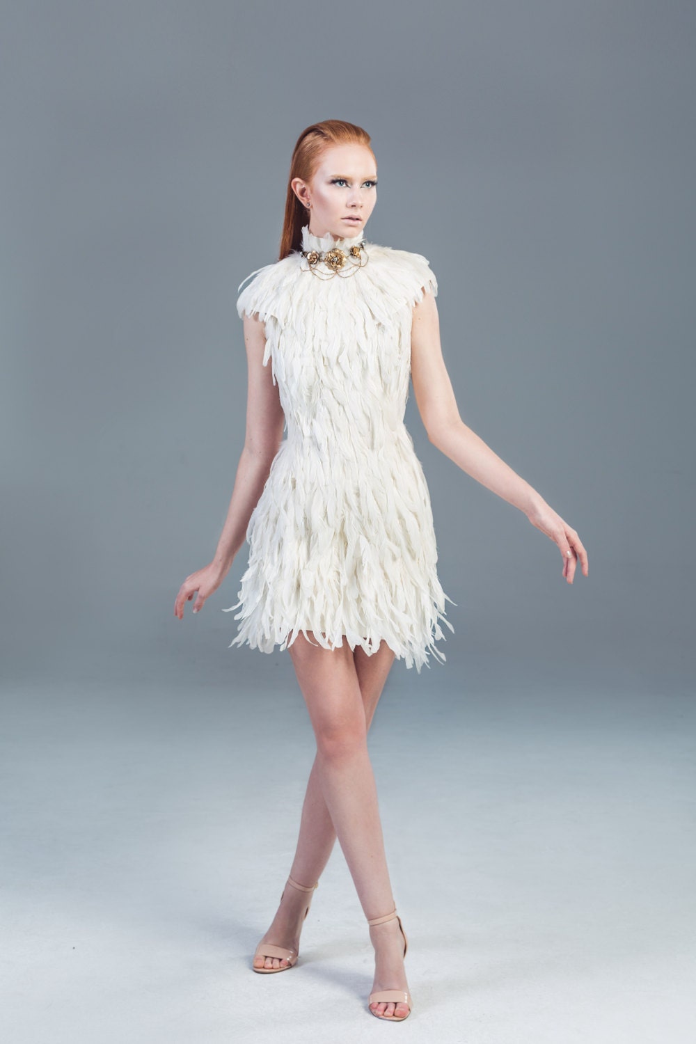 Illustrative example of white feather dress