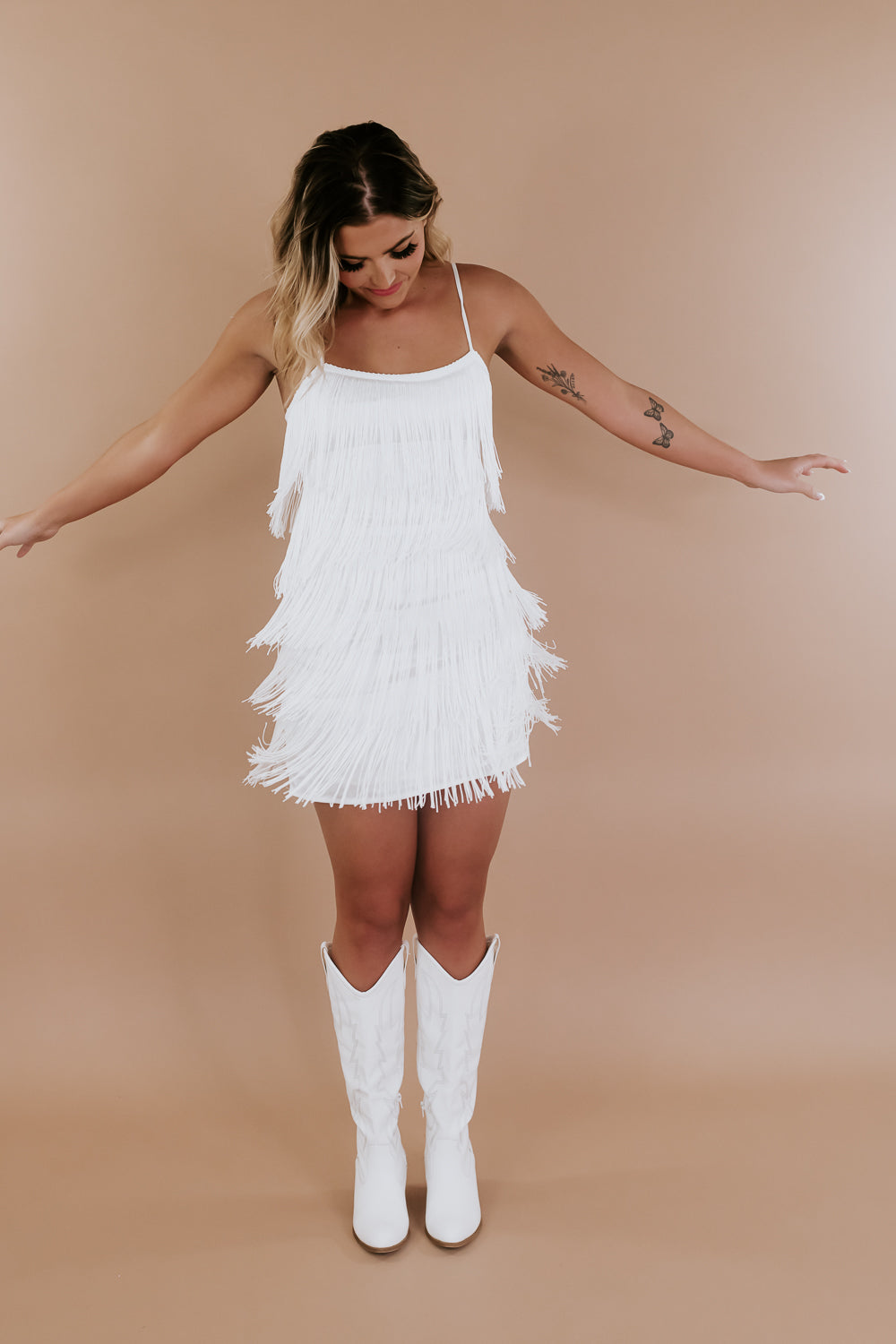 Illustrative example of white fringe dress