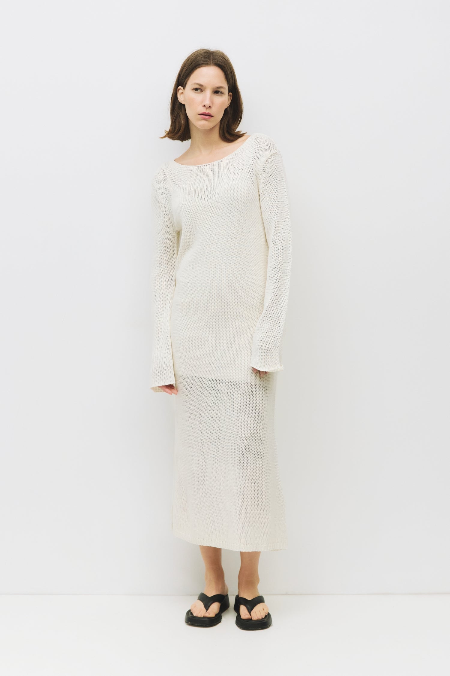 Illustrative example of white knit dress
