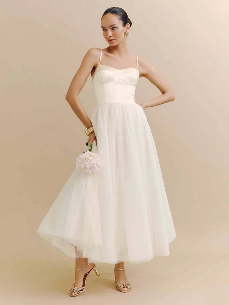 Illustrative example of white rehearsal dinner dress