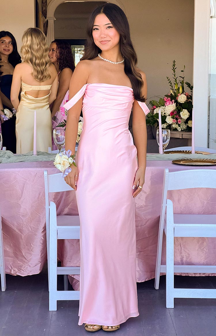 Illustrative example of women's light pink strapless off the shoulder dress