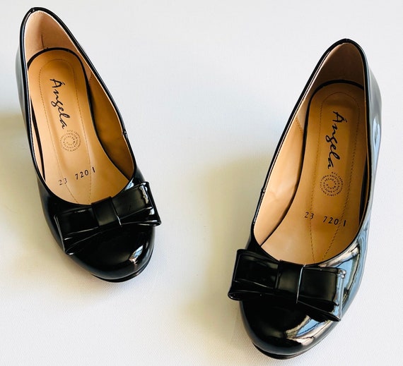 Illustrative example of womens low heel dress shoes