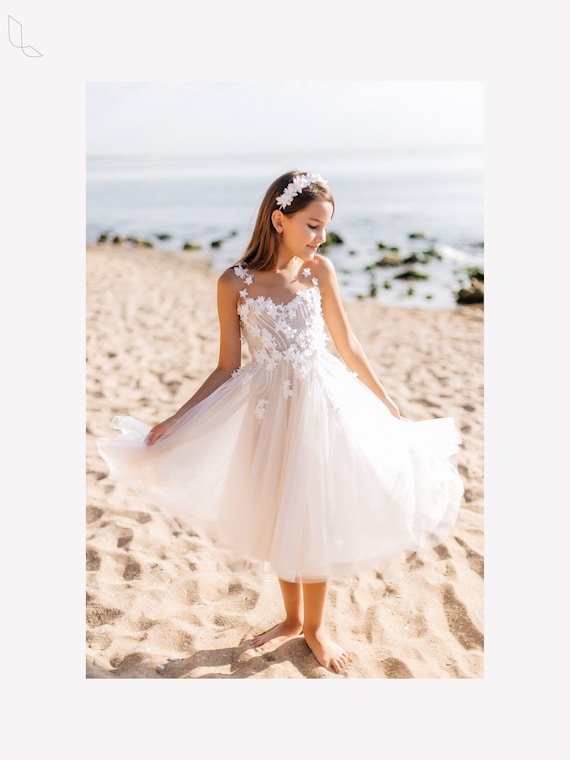 Illustrative example of ivory flower girl dresses from Google Search