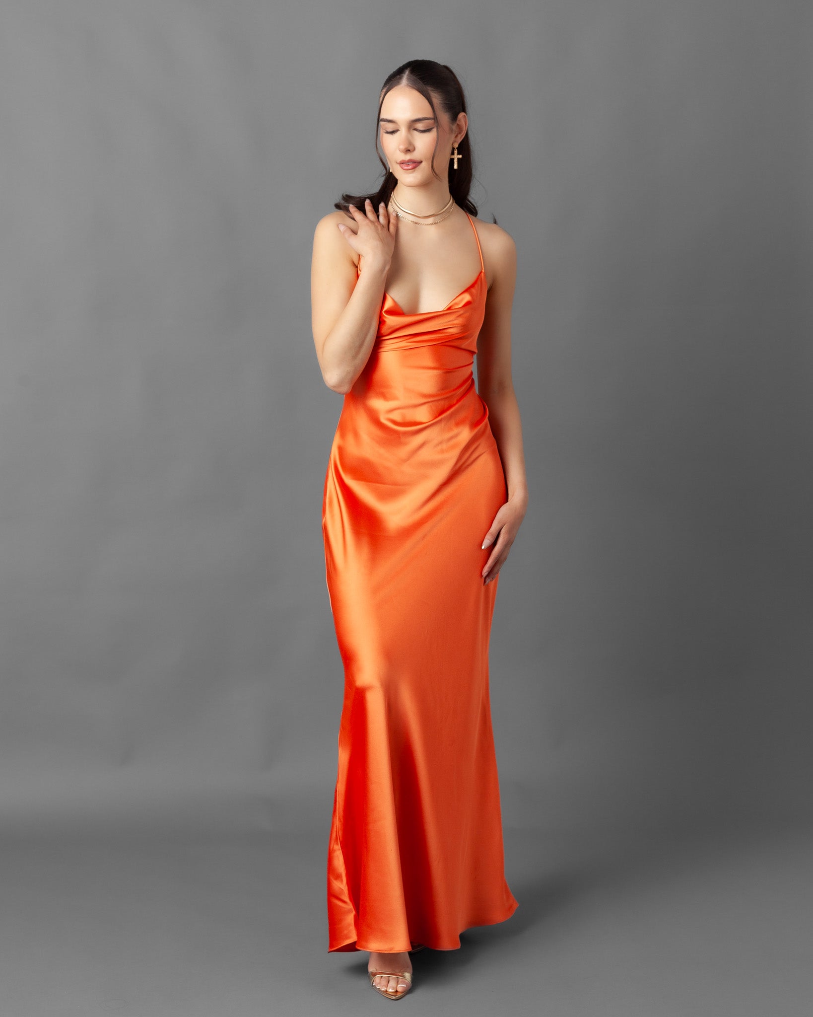 Illustrative example of orange satin dress from Google Search