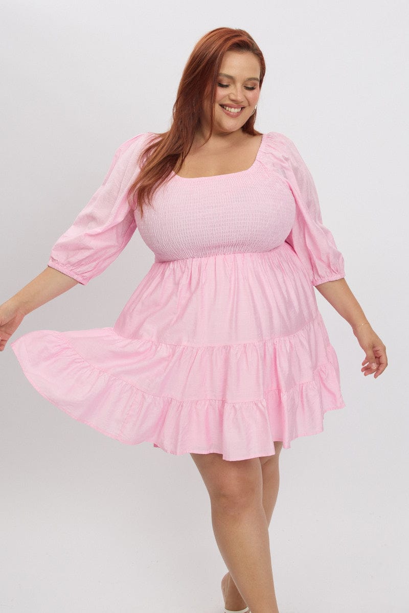 Illustrative example of plus size pink dresses from Google Search