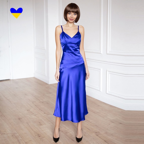 Illustrative example of satin blue dress from Google Search